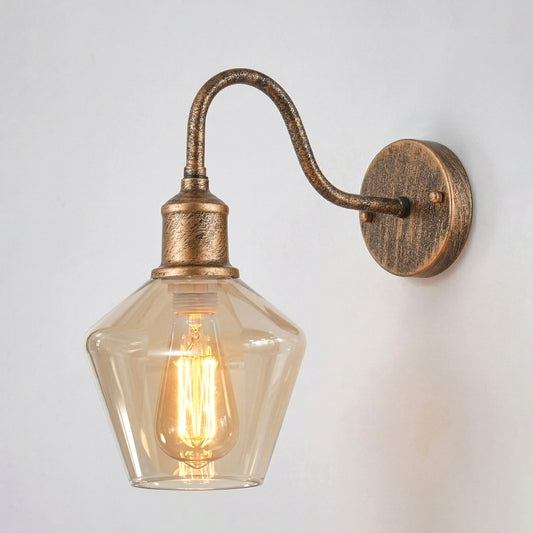 Fovant antique brass wall light fixture with a classic swan neck arm and a clear glass textured shade