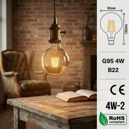 A warm amber glass pendant light bulb with a brass-toned socket hangs in a cozy room scene with a brick wall, armchair, and wooden table. A vertical informational panel on the right shows bulb dimensions, G95 4W B22 labeling, CE and 4W-2 marks, and a RoHS compliant logo.