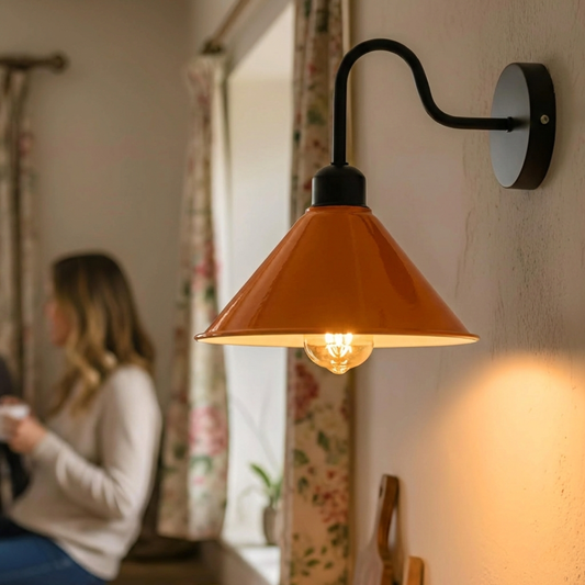 Wall-mounted lamp with a warm glow in a softly blurred room setting