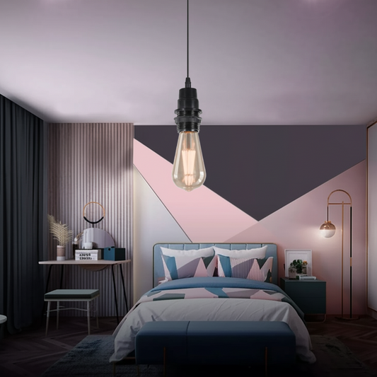 Modern bedroom with geometric wall design, bed, and pendant light.