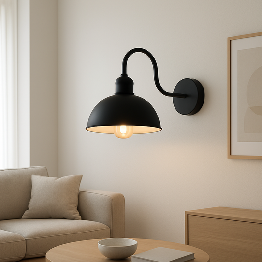 Black wall lamp on a beige wall above a sofa in a living room.
