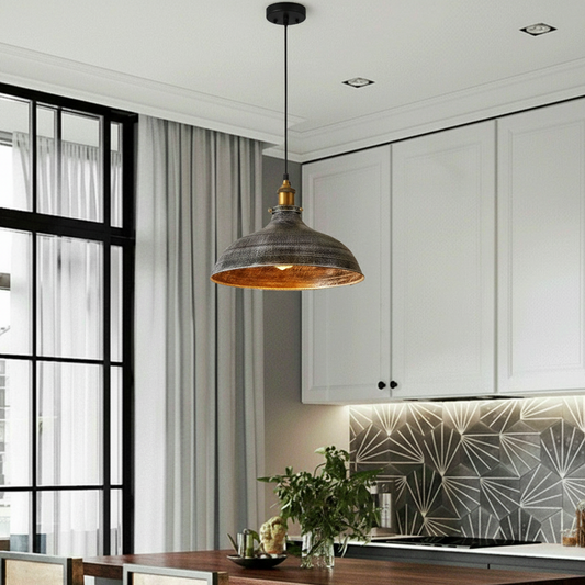 Modern kitchen with pendant light, white cabinets, and geometric backsplash.