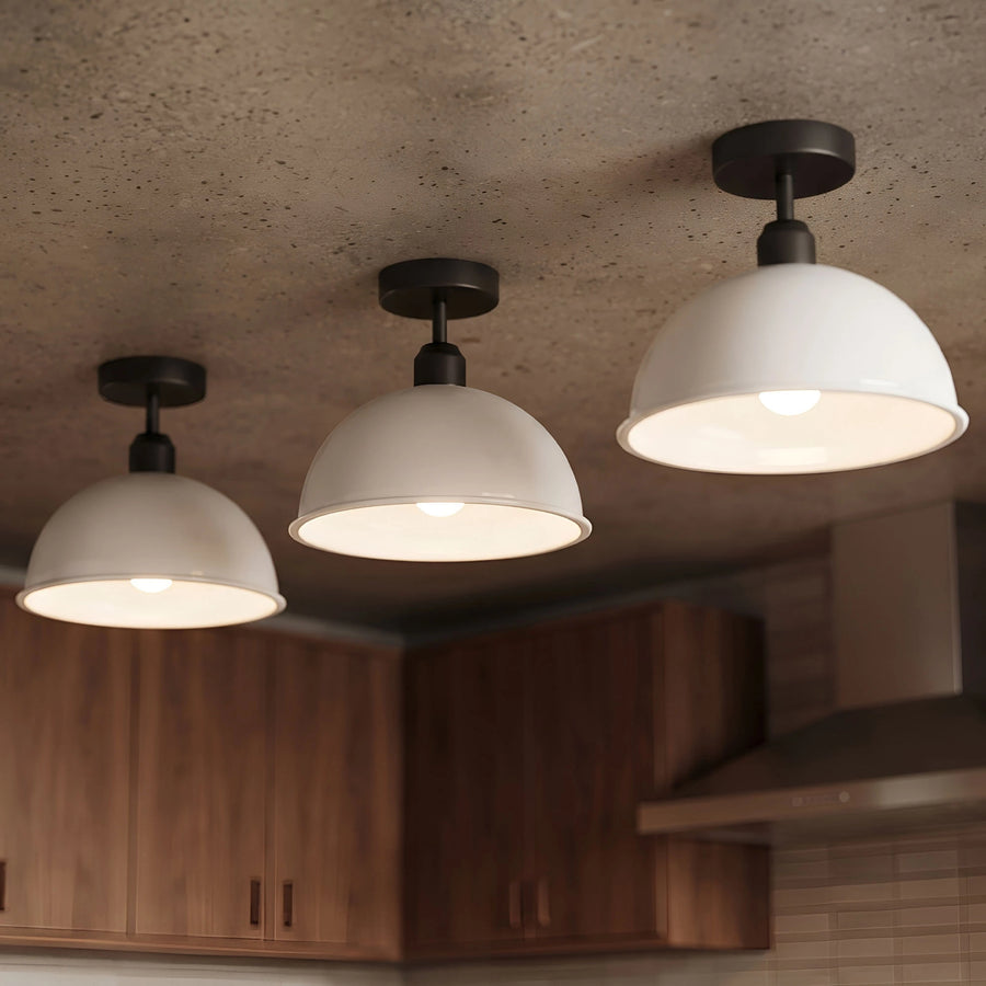 Industrial dome ceiling light with warm glow in a bedroom