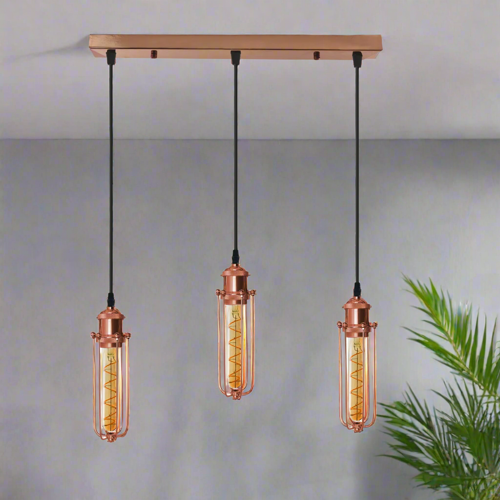 A rose gold ceiling E27 pendant light with three hanging lamp shades, featuring a vintage design with a metal wire cage.