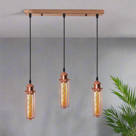 A rose gold ceiling E27 pendant light with three hanging lamp shades, featuring a vintage design with a metal wire cage.