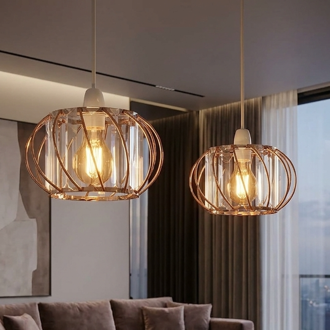 Modern living room with a gray sofa, marble table, and pendant lights.