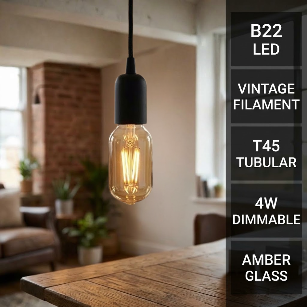 A hanging pendant light with a black socket and a glowing amber glass T45 bulb in a vintage filament design, shown in a softly blurred living room setting. A vertical text panel on the right lists features: B22 LED, VINTAGE FILAMENT, T45 TUBULAR, 4W DIMMABLE, AMBER GLASS.