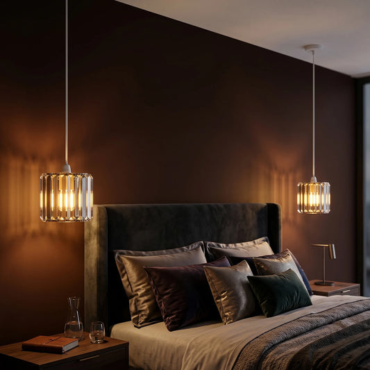Modern bedroom with dark walls, a bed with pillows, and pendant lights.