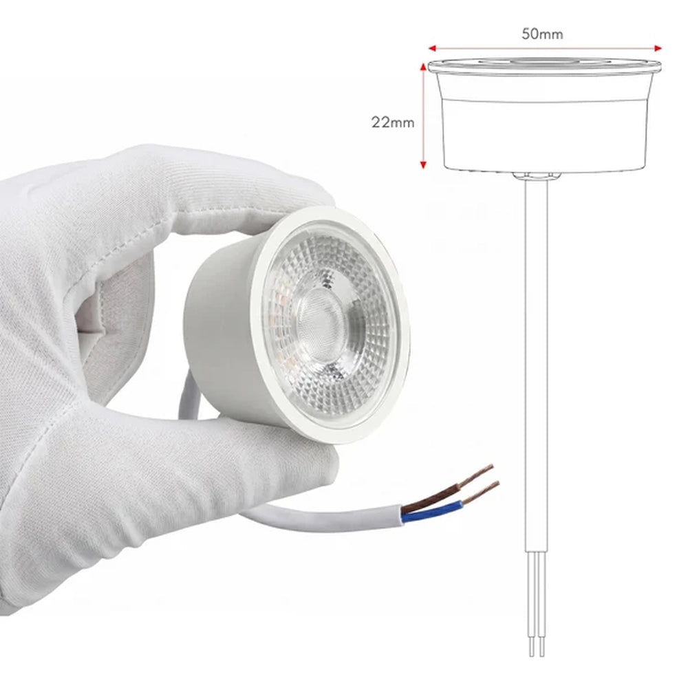 hand holding the 7W LED module beside a size drawing in millimetres