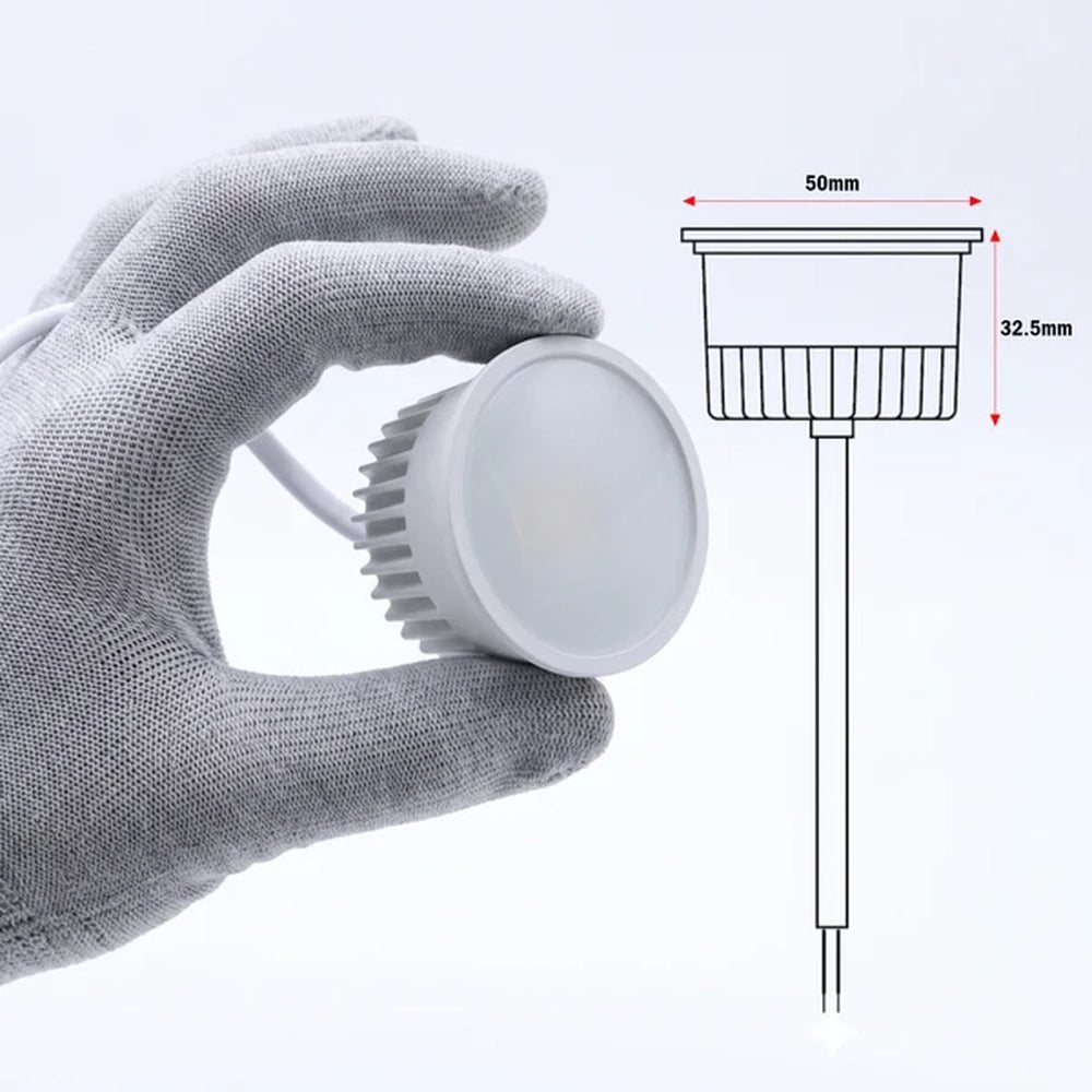 hand holding the LED module beside a size drawing in millimetres