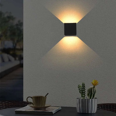 Up and down decorative outdoor wall light on exterior brick wall