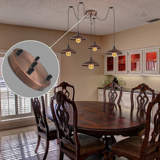 Round copper ceiling rose multi-drop light fitting zoomed in over a vintage dining table with pendant spider lights