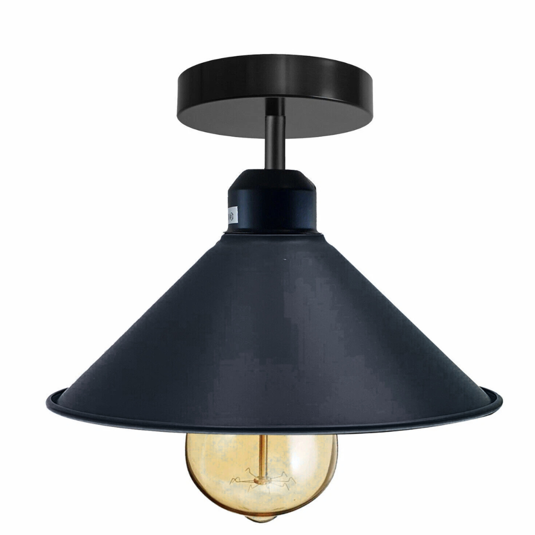 A vintage industrial black cone shade flush mount ceiling light fixture with a visible bulb, shown against a dark background.