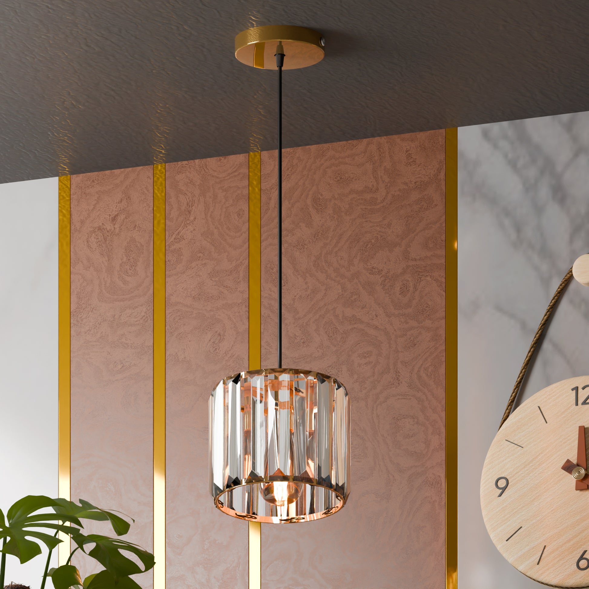 Modern pendant light hanging from a ceiling with a decorative wall and plant in the background