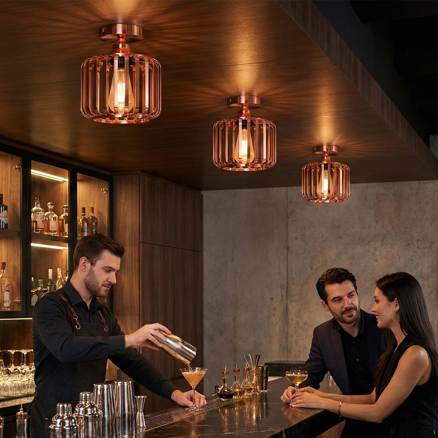 Rose gold cage ceiling light illuminating a modern kitchen space