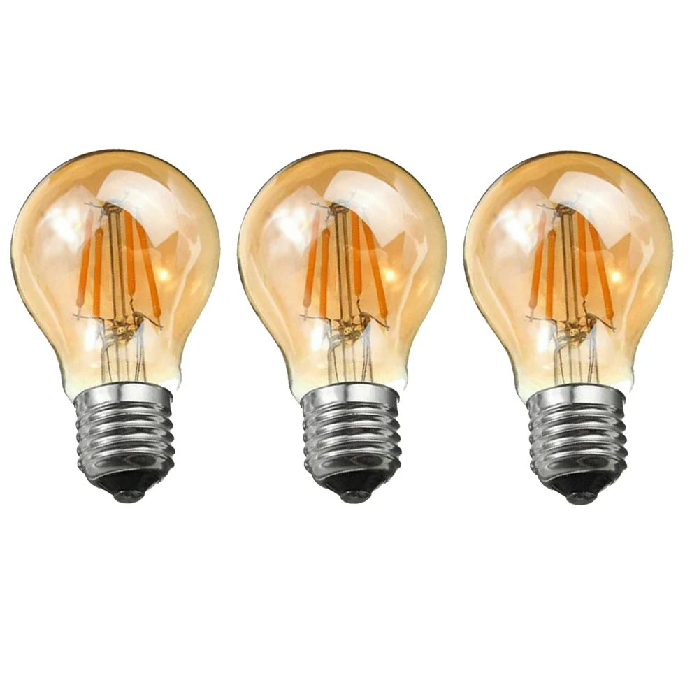 Three vintage-style LED filament light bulbs with clear glass and warm amber tones, shown side by side on a plain white background.