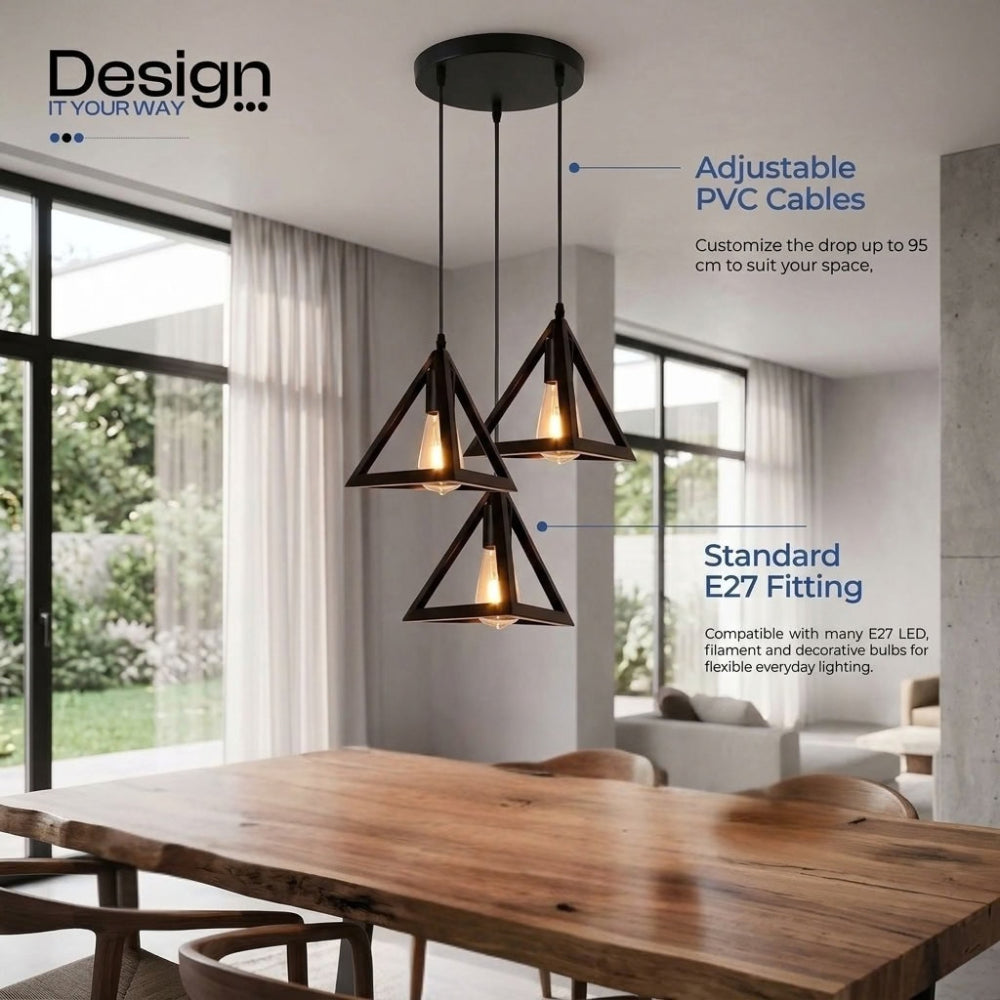 Three black geometric triangle pendant lights hanging over a wooden dining table in a modern room, with text callouts about adjustable PVC cables and standard E27 fitting.