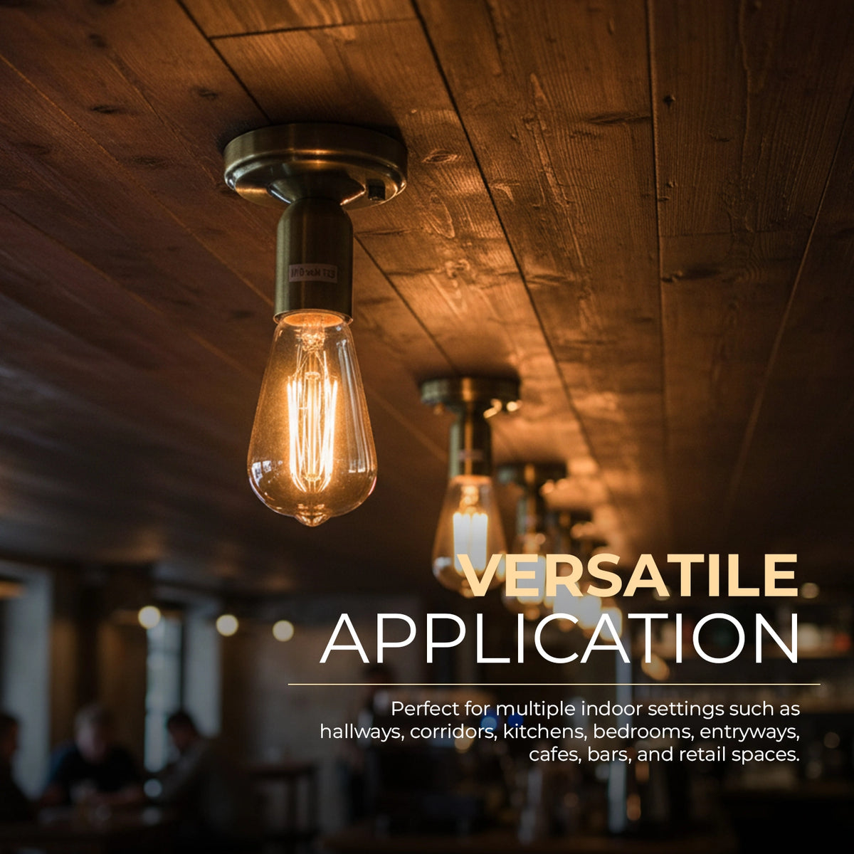 A warm Edison-style pendant light fixture mounted on a rustic wooden ceiling, with additional matching lights blurred in the background and overlaid text reading 'VERSATILE APPLICATION' and descriptive copy for indoor settings.