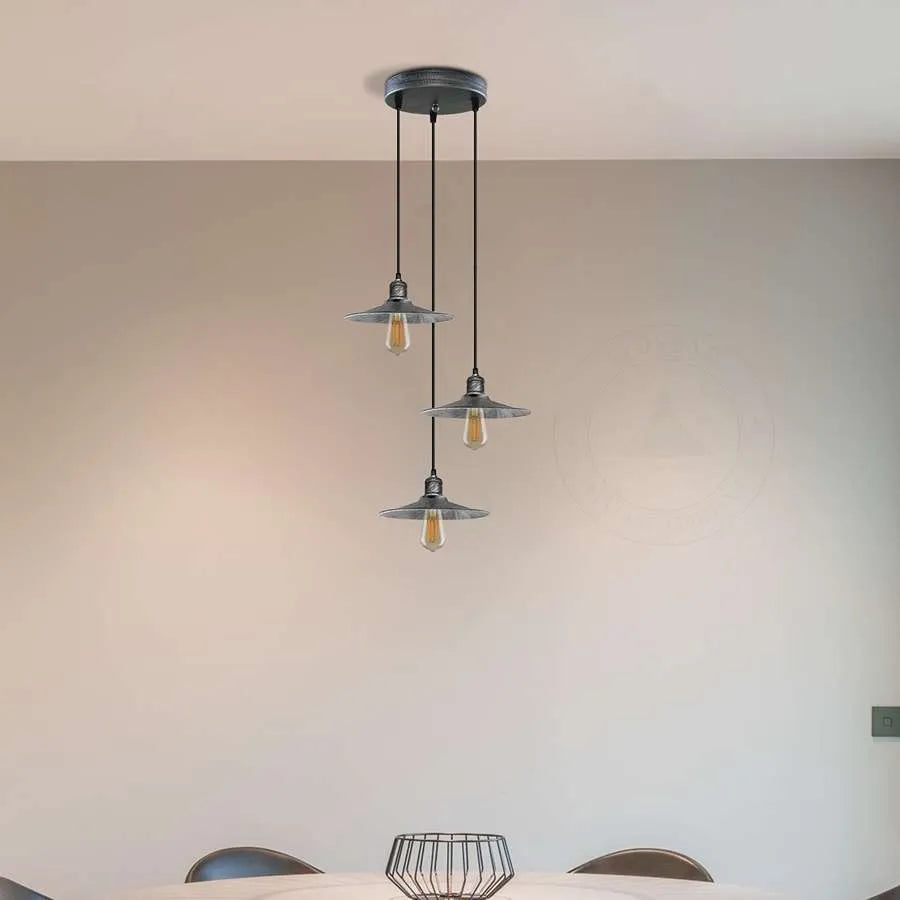 metal cone shade ceiling pendant light  over dining table 