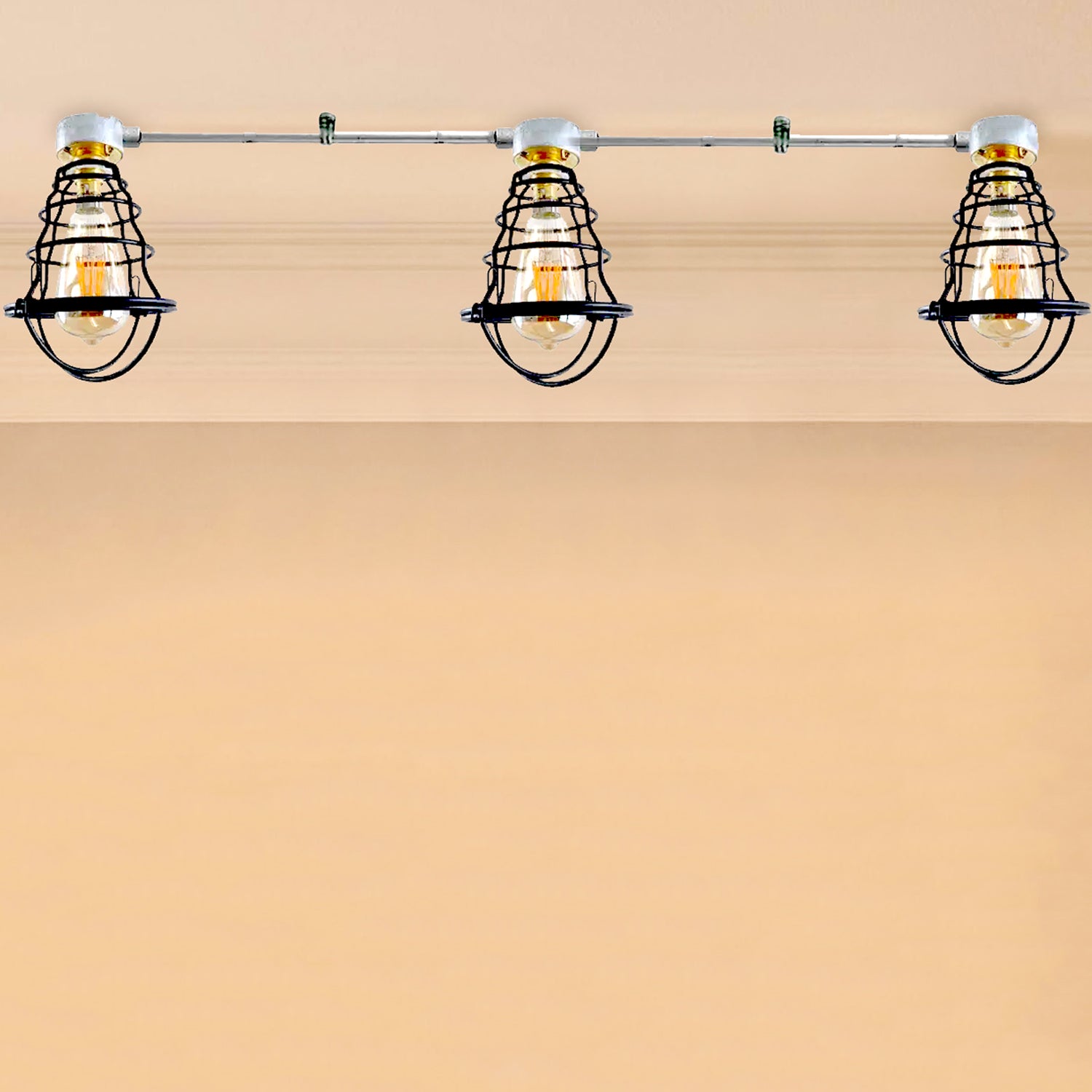 A series of three industrial ceiling lights with a B22 bulb base, mounted on a conduit pipe, against a plain background.