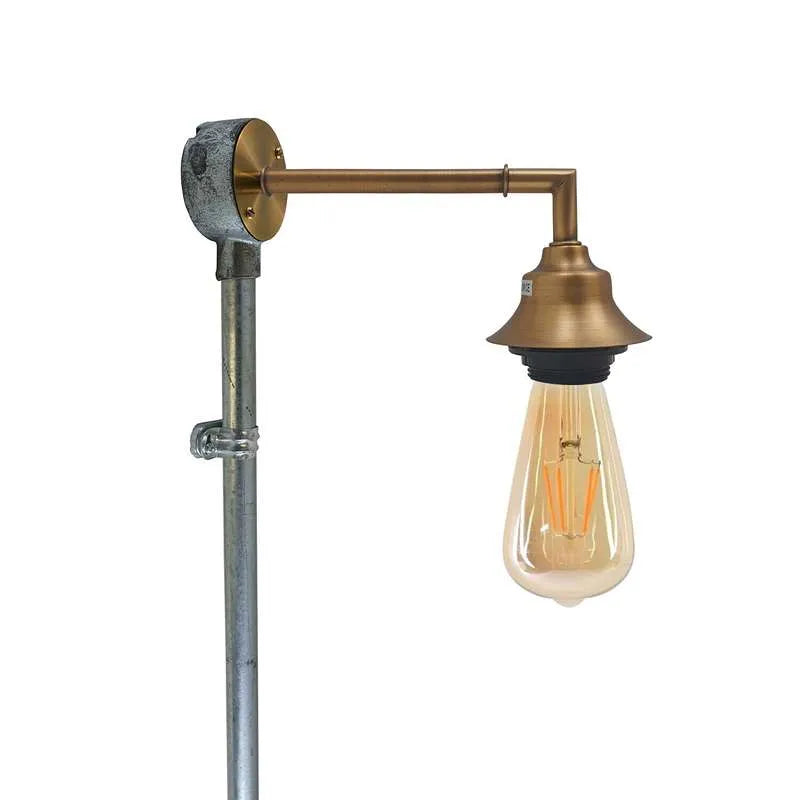 Yellow brass wall light with bulb