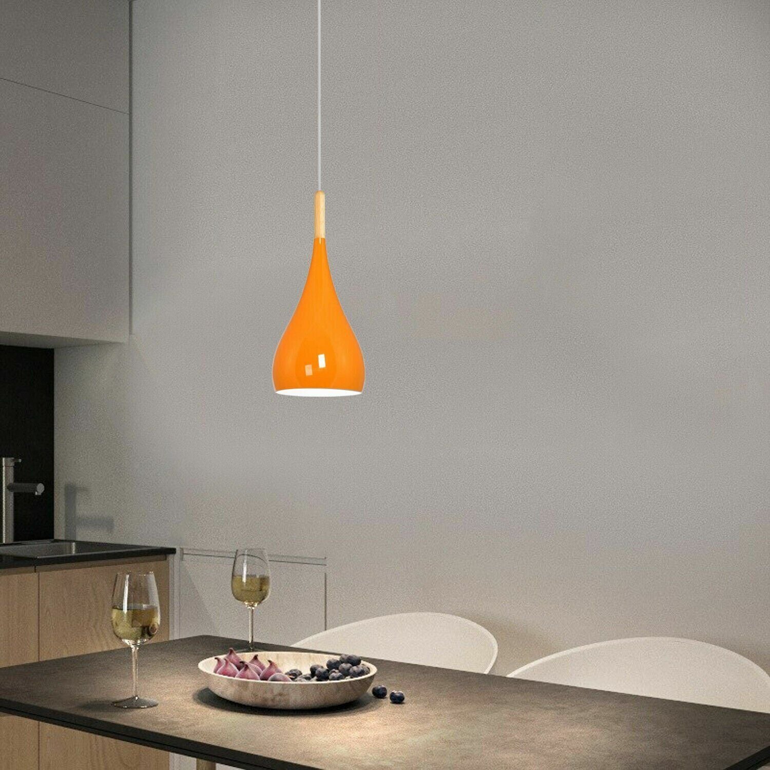 Orange ceiling pendant light over Dining table light