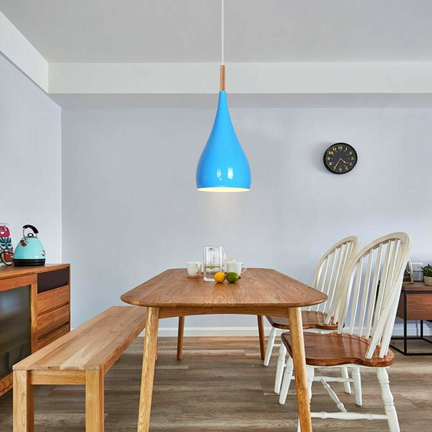 Blue ceiling pendant light over Dining table 