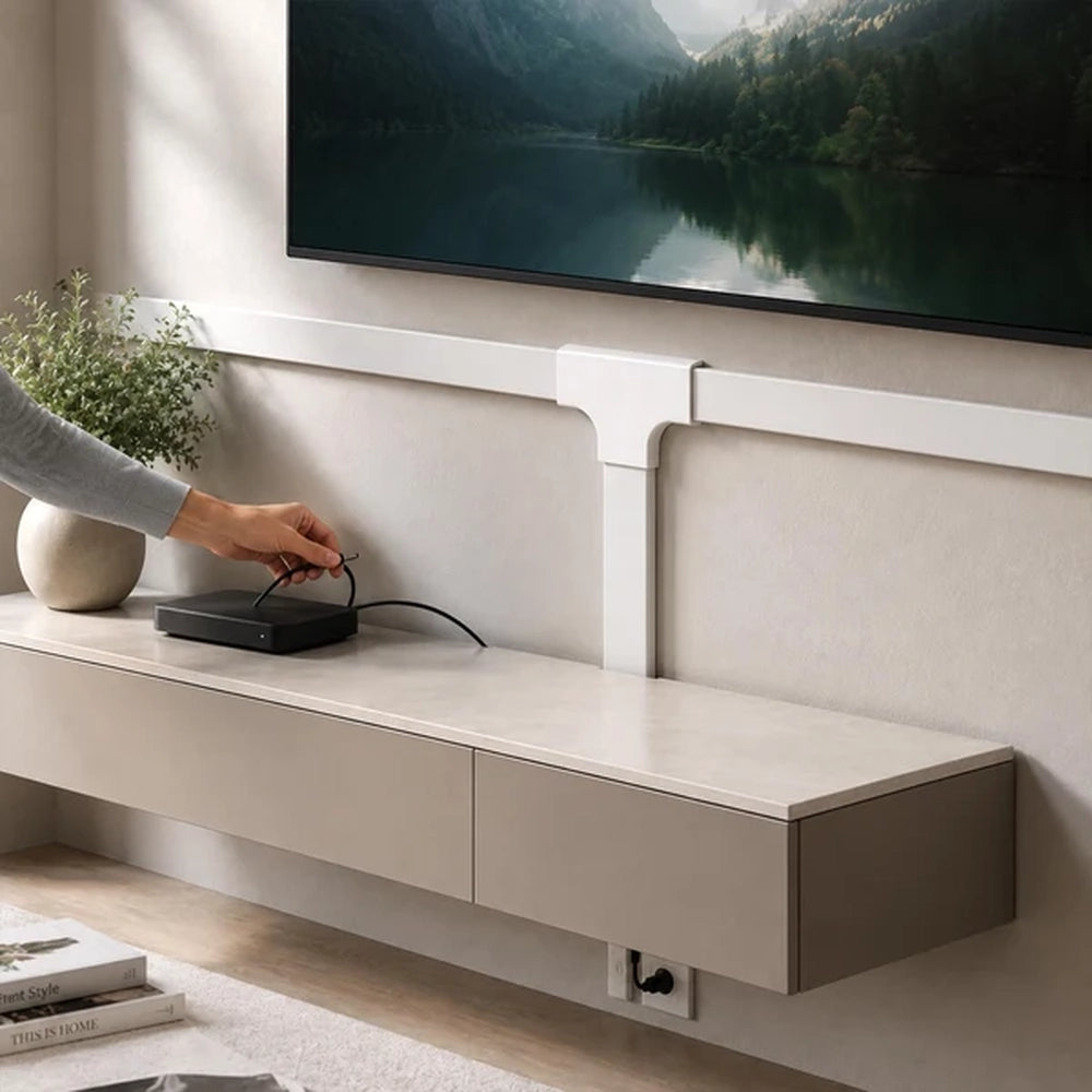 white trunking T-junction under a wall mounted TV